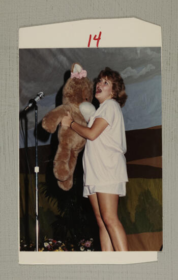 Unidentified Phi Mu Holding Teddy Bear in Convention Skit Photograph, July 6-10, 1986 (image)