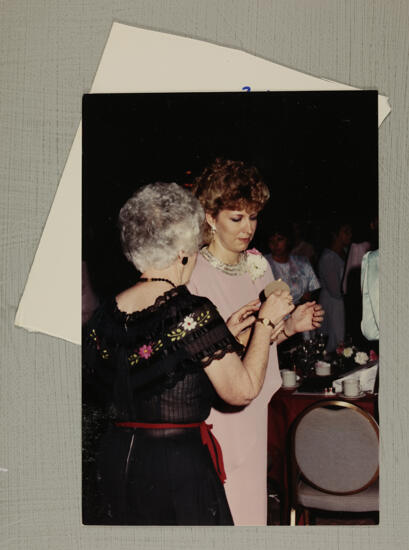 Unidentified Phi Mus Lighting Candles at Convention Banquet Photograph, July 6-10, 1986 (image)