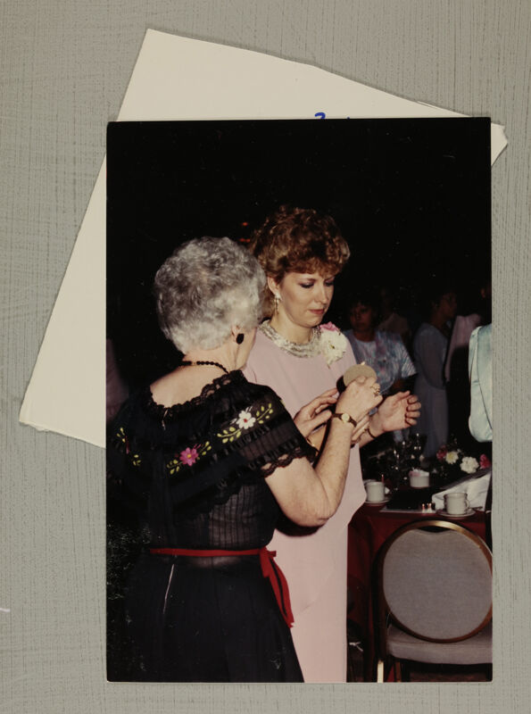 Unidentified Phi Mus Lighting Candles at Convention Banquet Photograph, July 6-10, 1986 (Image)