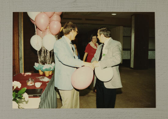 Joe Ott and Dan Hurgoi with Balloons at Convention Photograph, July 6-10, 1986 (image)