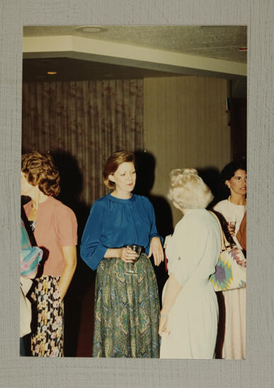 Cathy Moore Talking With Phi Mus at Convention Reception Photograph, July 6-10, 1986 (image)