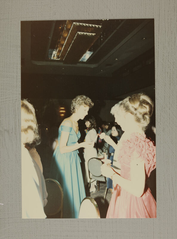 Pam Wadsworth Lighting Candle at Convention Banquet Photograph 1, July 6-10, 1986 (Image)