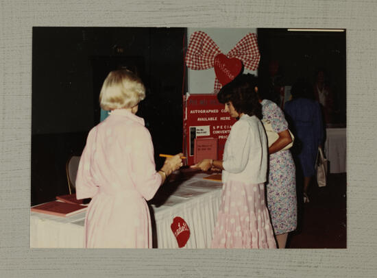 Annadell Lamb Autographing Phi Mu History Books at Convention Photograph 2, July 6-10, 1986 (image)