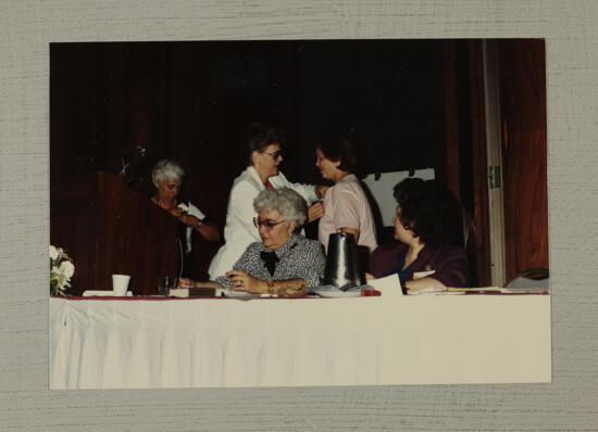 Becky Napper Receiving Badge at Convention Photograph, July 6-10, 1986 (image)