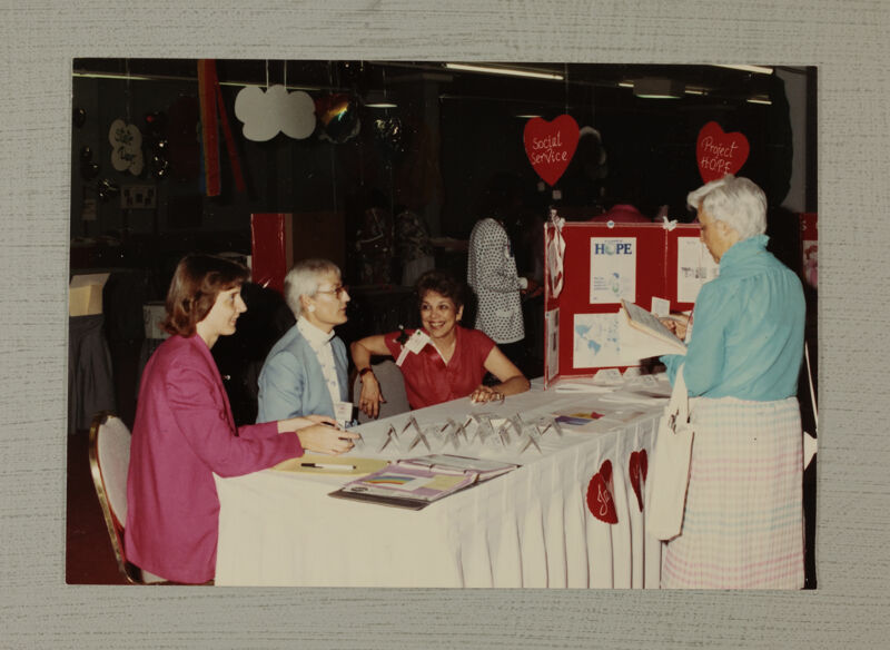 Spivey, Downing, and Henson at Project HOPE Convention Display Photograph, July 6-10, 1986 (Image)