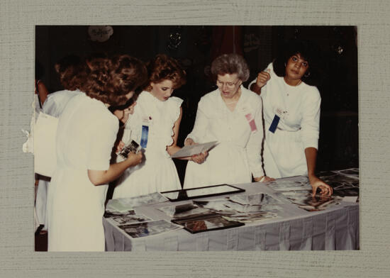 Marty Pugh Shows Photographs to Convention Delegates Photograph, July 1-4, 1994 (image)