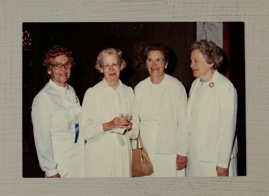 Four Alumnae in White Dresses at Convention Photograph, July 6-10, 1986 (image)