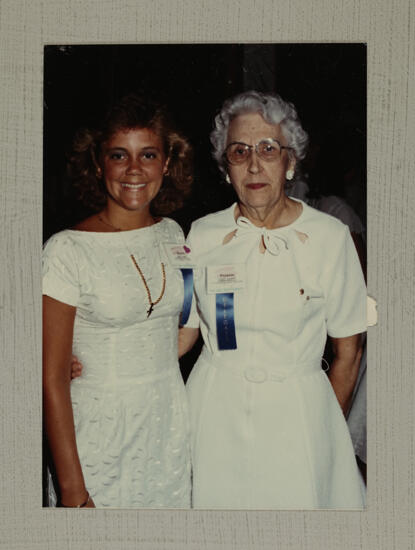 Unidentified and Frances McAdams in White Dresses at Convention Photograph, July 6-10, 1986 (image)