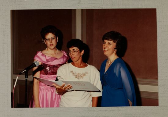 Three Phi Mus at Microphone During Convention Photograph, July 1-5, 1988 (image)