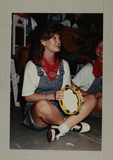 Washboard Band Member with Tambourine at Convention Photograph 2, July 1-5, 1988 (image)