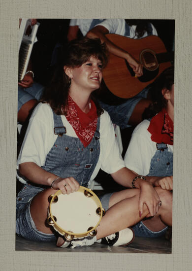 Washboard Band Member with Tambourine at Convention Photograph 1, July 1-5, 1988 (image)