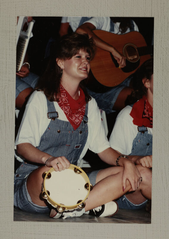 Washboard Band Member with Tambourine at Convention Photograph 1, July 1-5, 1988 (Image)