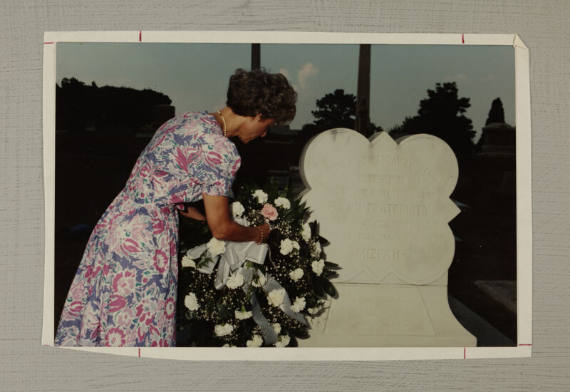 Pam Wadsworth Placing Wreath on Martha Redding's Grave Photograph, July 1-5, 1988 (Image)