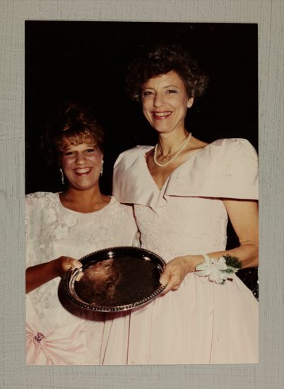 Pam Wadsworth and Unidentified Collegian with Convention Award Photograph, July 6-9, 1990 (image)