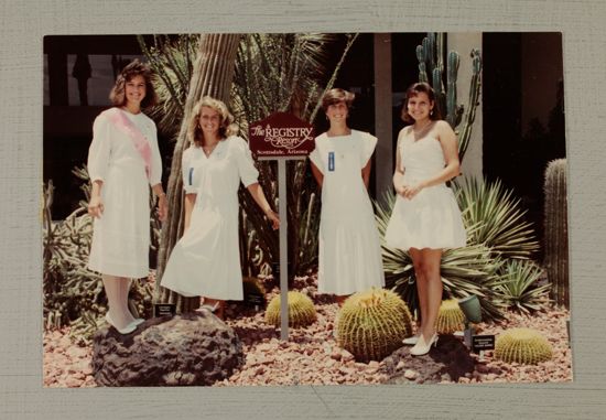 Four Phi Mus by Resort Sign at Convention Photograph, July 6-9, 1990 (image)