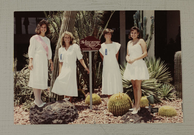 Four Phi Mus by Resort Sign at Convention Photograph, July 6-9, 1990 (Image)