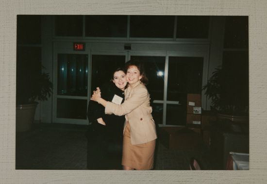 Two Phi Mus Hug at Convention Photograph, July 1-4, 1994 (image)