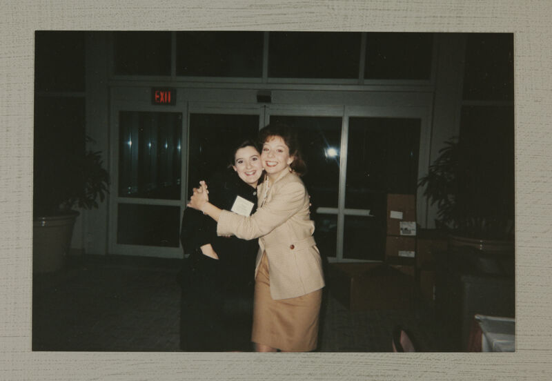 Two Phi Mus Hug at Convention Photograph, July 1-4, 1994 (Image)