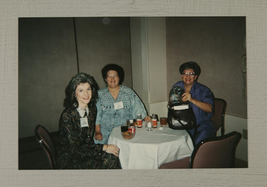 Three Phi Mus Enjoy Refreshments at Convention Photograph, July 1-4, 1994 (image)