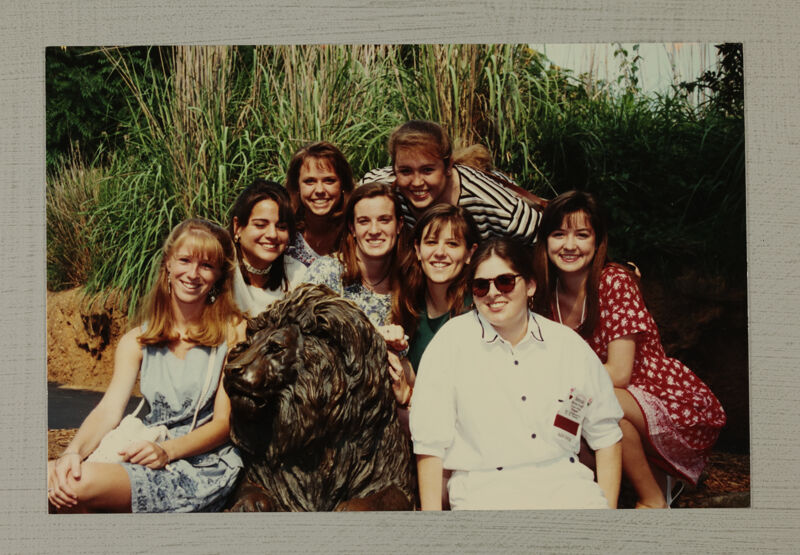 Group of Eight by Lion Statue at Convention Photograph, July 1-4, 1994 (Image)