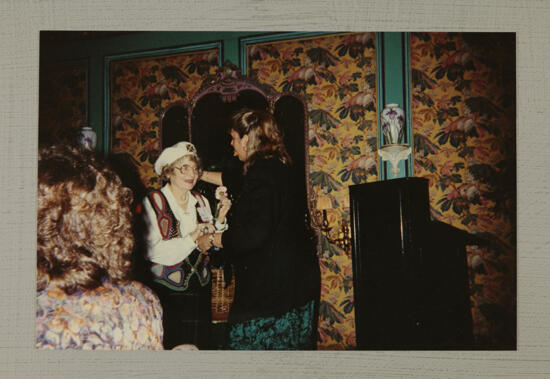 Unidentified Phi Mu Presenting Carnation at Convention Photograph, July 1-4, 1994 (image)