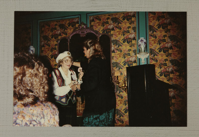 Unidentified Phi Mu Presenting Carnation at Convention Photograph, July 1-4, 1994 (Image)