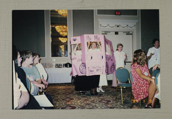 Phi Mus in Cardboard Bus for Convention Skit Photograph, July 1-4, 1994 (image)