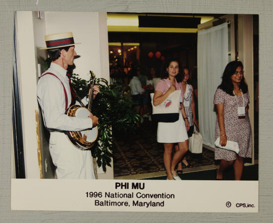 Banjo Player Entertaining Convention Attendees Photograph, July 4-8, 1996 (image)