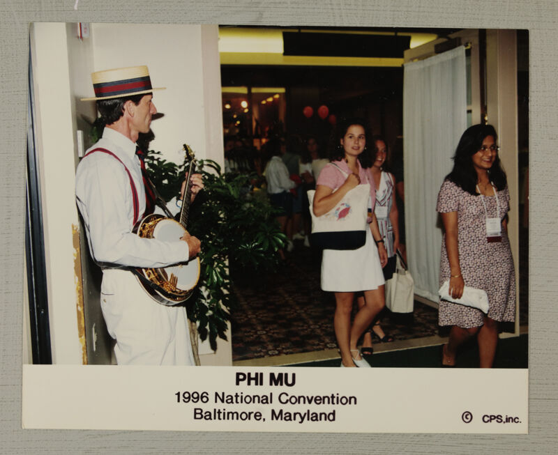 July 4-8 Banjo Player Entertaining Convention Attendees Photograph Image