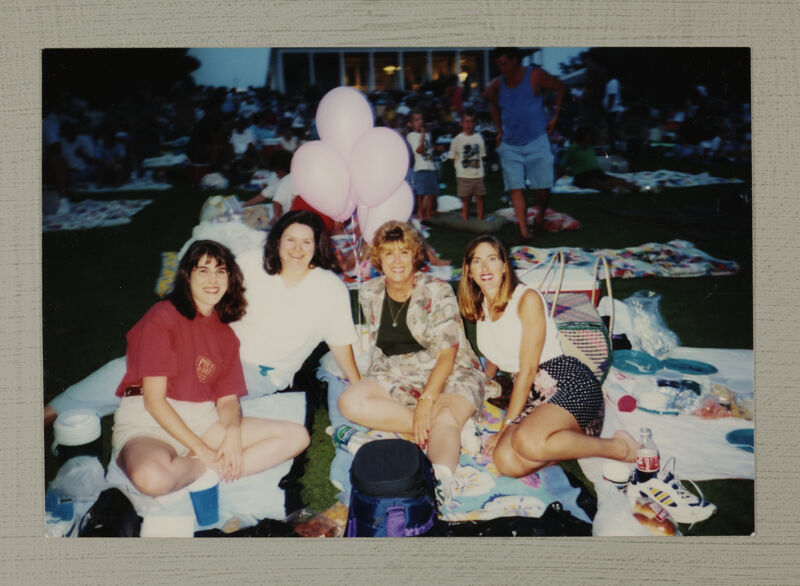 Four Phi Mus Outside on Blankets at Convention Photograph, July 4-8, 1996 (Image)
