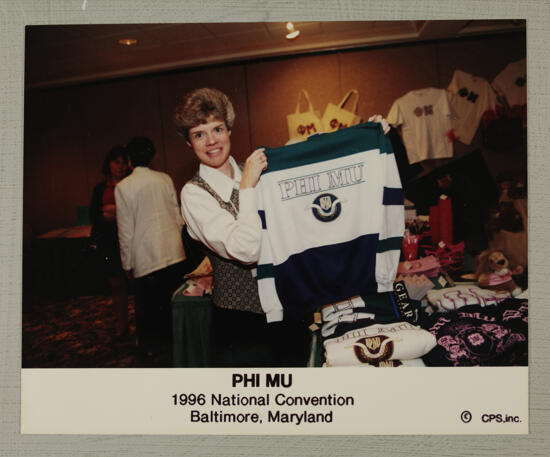 Vicki Ryan Holding Phi Mu Sweatshirt at Convention Photograph, July 4-8, 1996 (image)