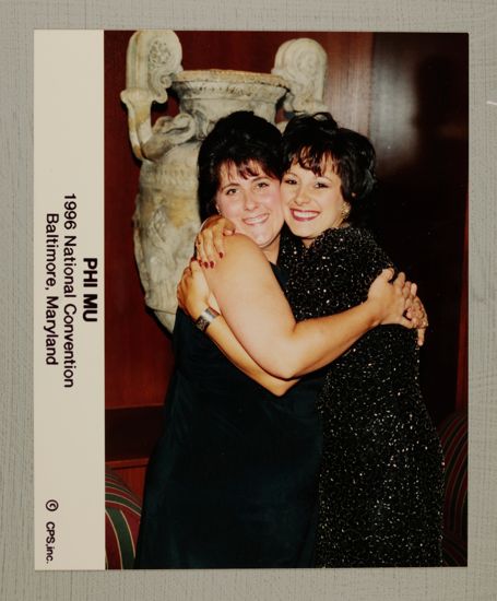 Two Phi Mus Hugging at Convention Photograph, July 4-8, 1996 (image)