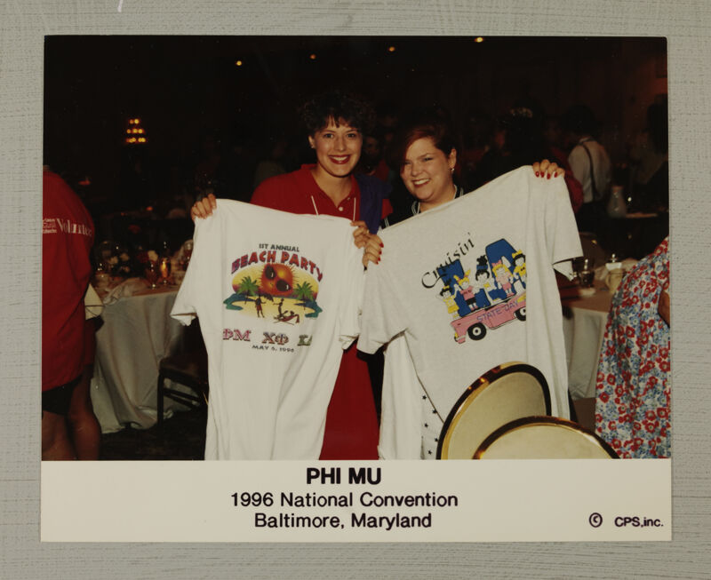 Two Phi Mus Displaying T-Shirts at Convention Photograph, July 4-8, 1996 (Image)