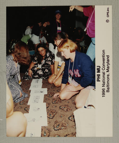 Phi Mus Examining Materials at Convention Photograph, July 4-8, 1996 (image)