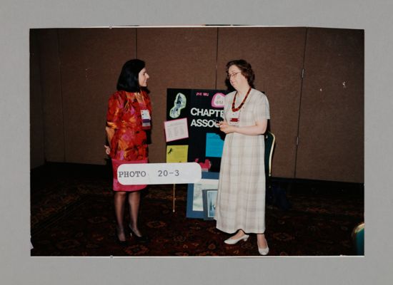 Two Phi Mus with Chapter Association Poster at Convention Photograph, July 3-5, 1998 (image)