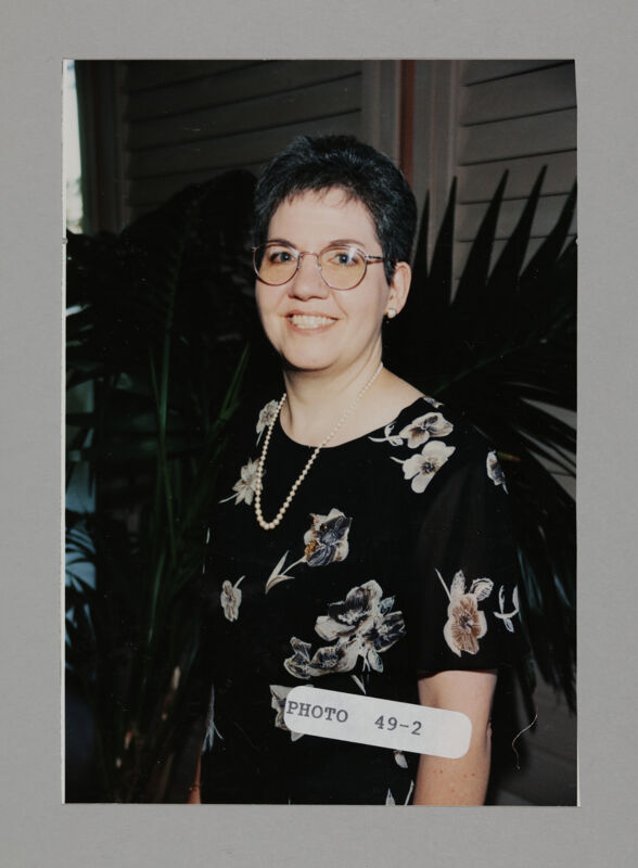 Unidentified Phi Mu in Flowered Dress at Convention Photograph, July 3-5, 1998 (Image)