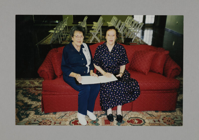 July 3-5 Marguerite and Betty Wilkinson on Red Sofa Photograph Image