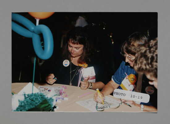 Phi Mus Coloring at Convention Philanthropy Party Photograph 1, July 3-5, 1998 (image)