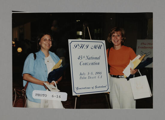 Kim Young and Unidentified by Convention Sign Photograph, July 3-5, 1998 (image)