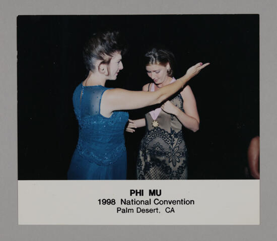 Frances Mitchelson Presenting Medal at Convention Photograph, July 3-5, 1998 (image)