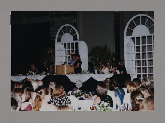 Jen Wesley and Karen Belanger Inviting Phi Mus to Next Convention Photograph 2, July 3-5, 1998 (image)