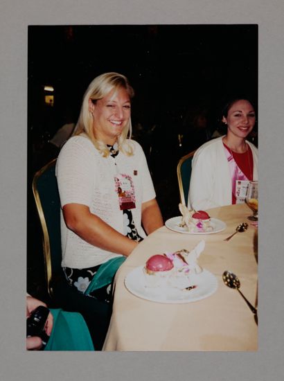 Kristen Bridges and Meghan Hilleboe Enjoying Dessert at Convention Photograph, July 3-5, 1998 (image)