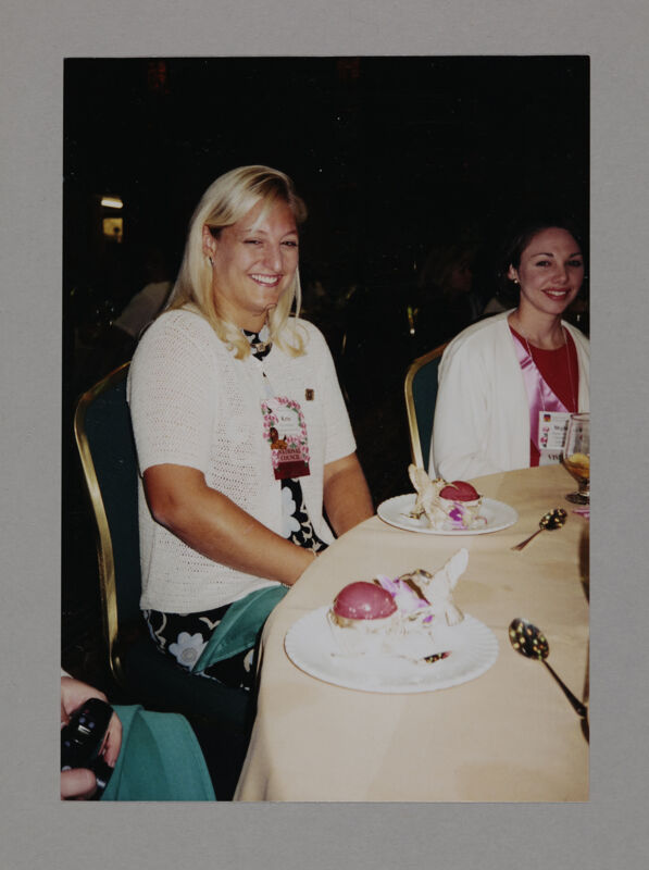Kristen Bridges and Meghan Hilleboe Enjoying Dessert at Convention Photograph, July 3-5, 1998 (Image)