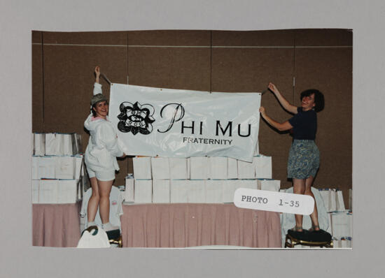 Two Phi Mus Hanging Banner at Convention Photograph, July 3-5, 1998 (image)