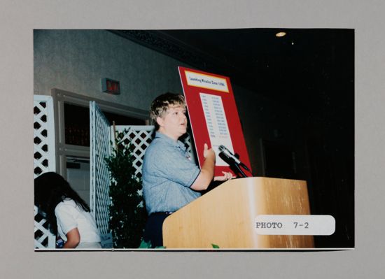 Renee Peterson with Launching Miracles Chart at Convention Photograph, July 3-5, 1998 (image)