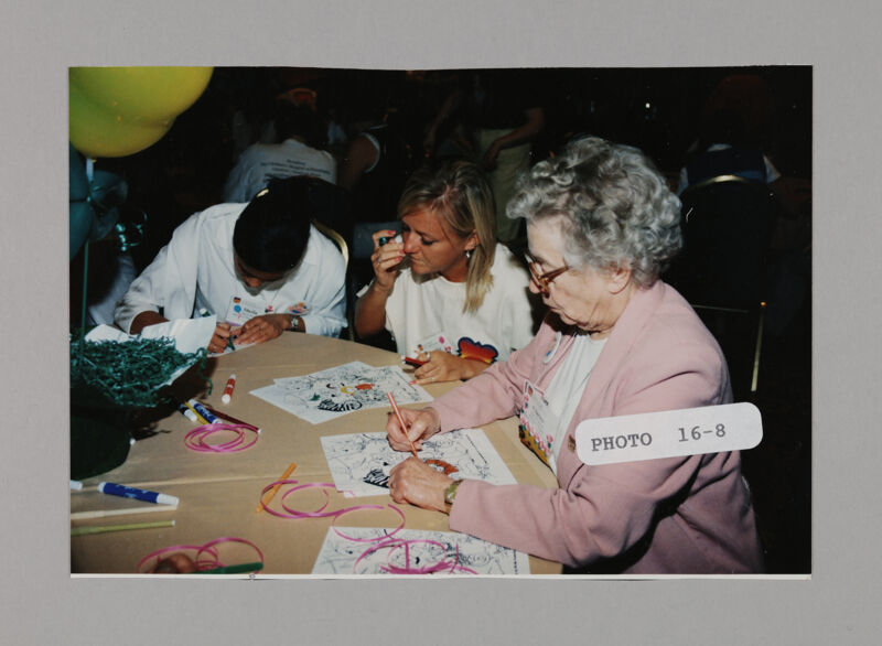 Phi Mus Coloring at Convention Philanthropy Party Photograph 2, July 3-5, 1998 (Image)