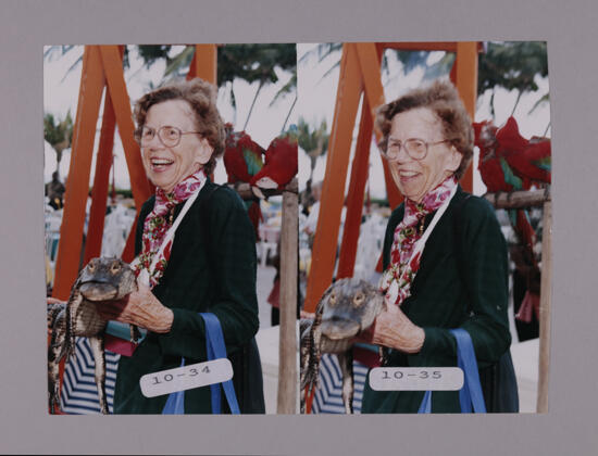 Marion Phillips Holding Crocodile at Convention Opening Dinner Photosheet, July 7-10, 2000 (image)