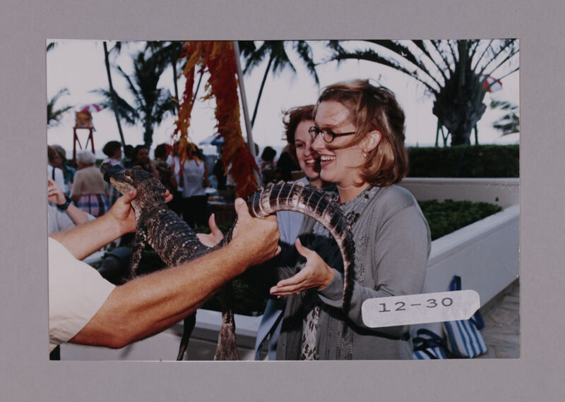 Katie Starrett with Crocodile at Convention Opening Dinner Photograph, July 7-10, 2000 (Image)