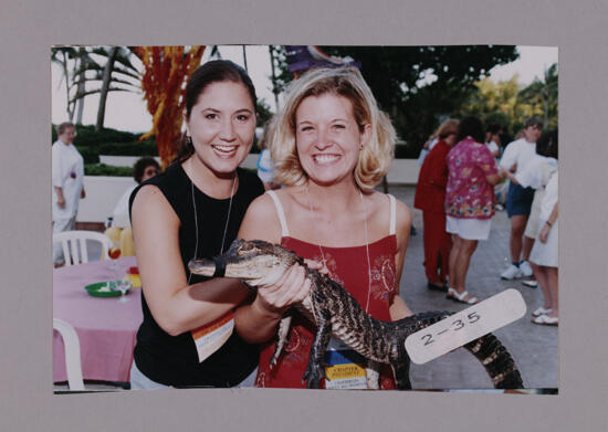 Two Phi Mus Holding Crocodile at Convention Opening Dinner Photograph 1, July 7-10, 2000 (image)