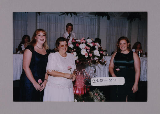 Mother and Two Daughters by Convention Ice Sculpture Photograph, July 7-10, 2000 (image)